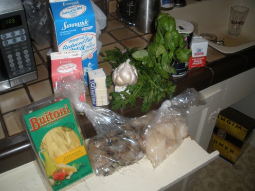 Of what you see I used ¼ cup butter or margarine, 2 cloves garlic, minced, 2 tablespoons all-purpose flour, ½ teaspoon salt, ½ cup half-and-half, 1 cup milk, 1/3 cup snipped fresh parsley, ¼ cup snipped fresh basil, 1 pound medium-sized shrimp, shelled and deveined, 1 pound sea scallop, 20 ounces fresh fettuccine, cooked and drained, freshly grated parmesan cheese.